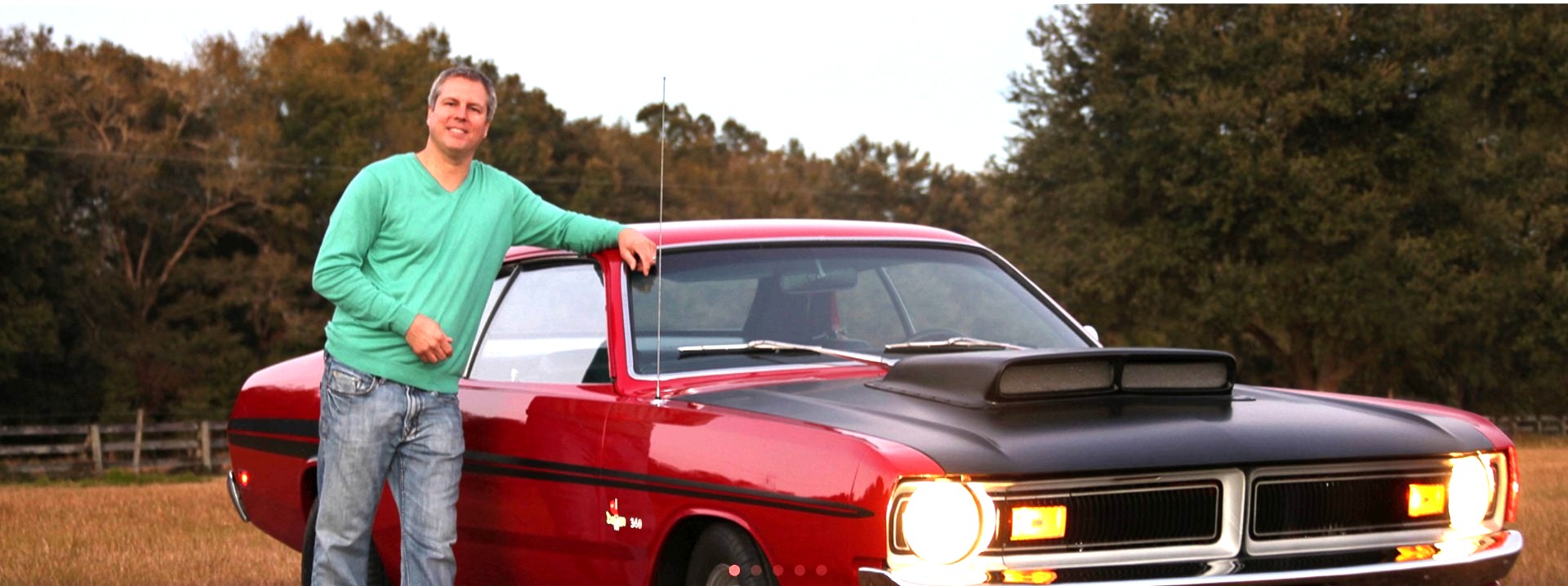 Chris Johnson Jr with a 1971 Dodge Dart Demon at sunset